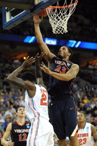 Mike Scott shoots a layup as future teammate Brad Beal looks on (Photo by Eric Francis / Getty Images)