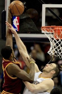 The caption on this picture says "Kosta Koufos, right, fouls Cleveland Cavaliers' Tristan Thompson left, who scored the basket"